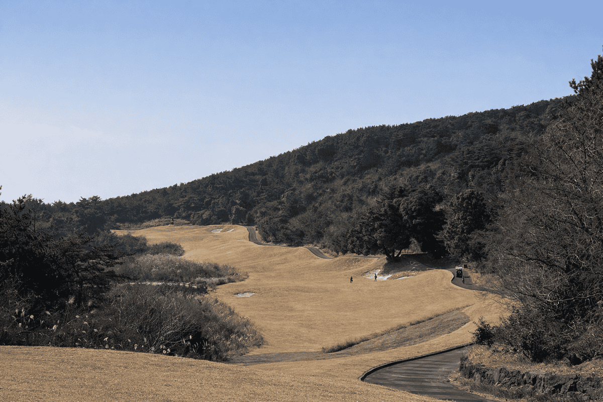 Winter fairway view at Phantom Golf Club Jeju with rolling hills and strategic bunker layout