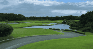 Beautiful landscaping with hazards and lush greenery at Pine Beach CC.